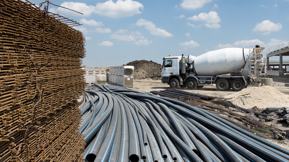 Construction site with tubes and cement truck