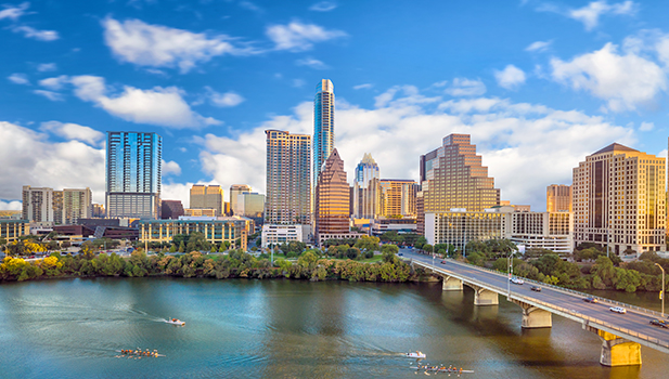 Austin Texas skyline with water and bridge